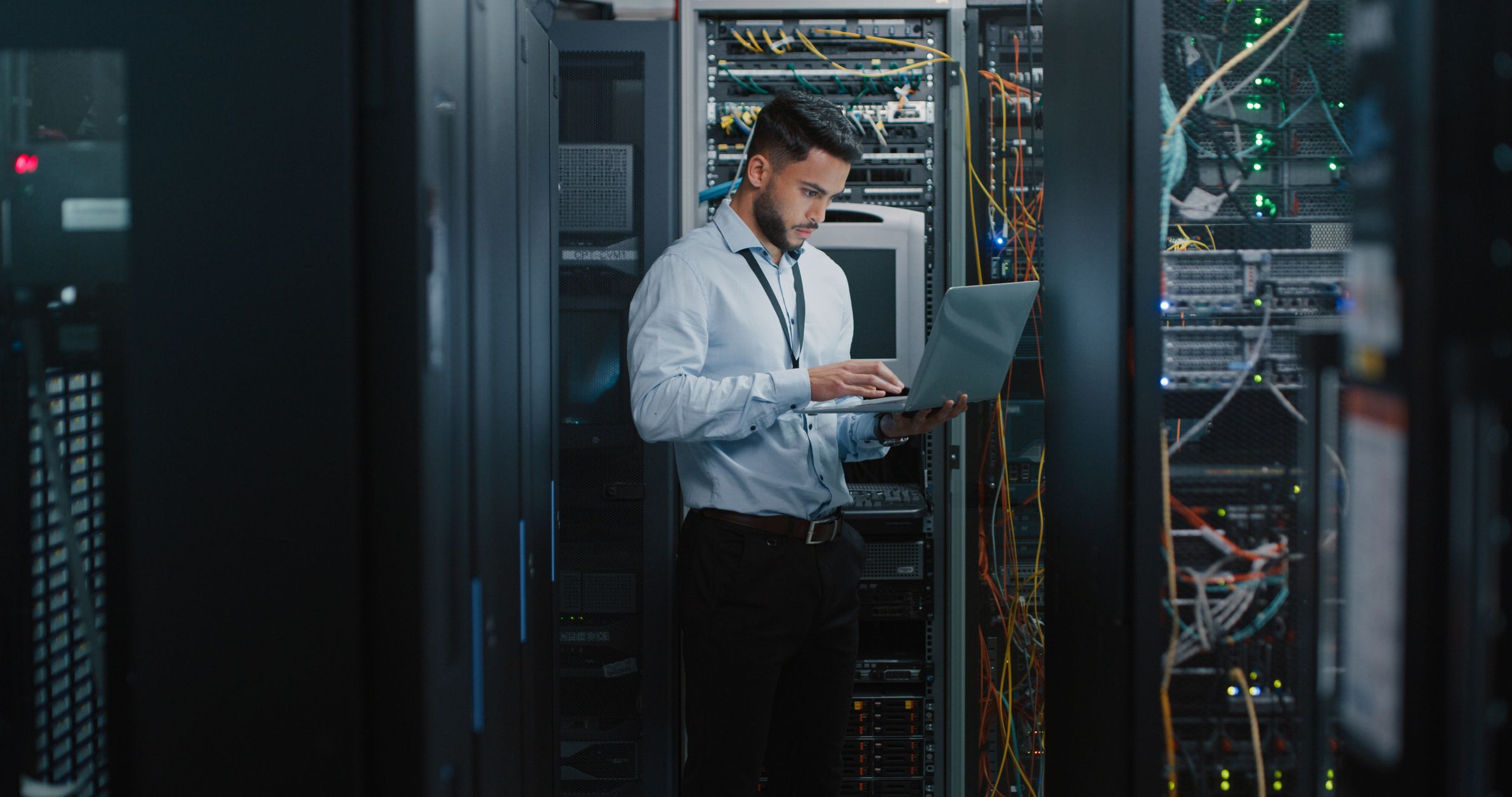 One man working in a server room
