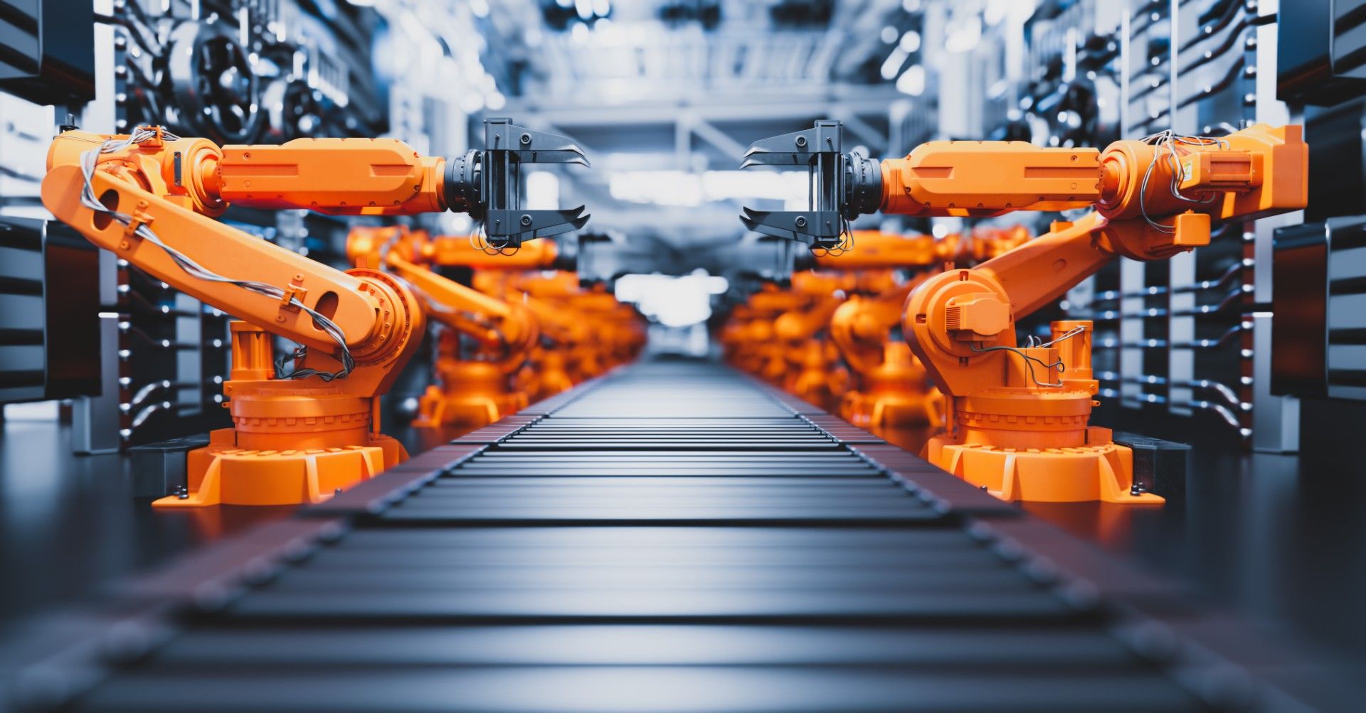 Rows of orange industrial robotic arms working along a conveyor line in an automated factory