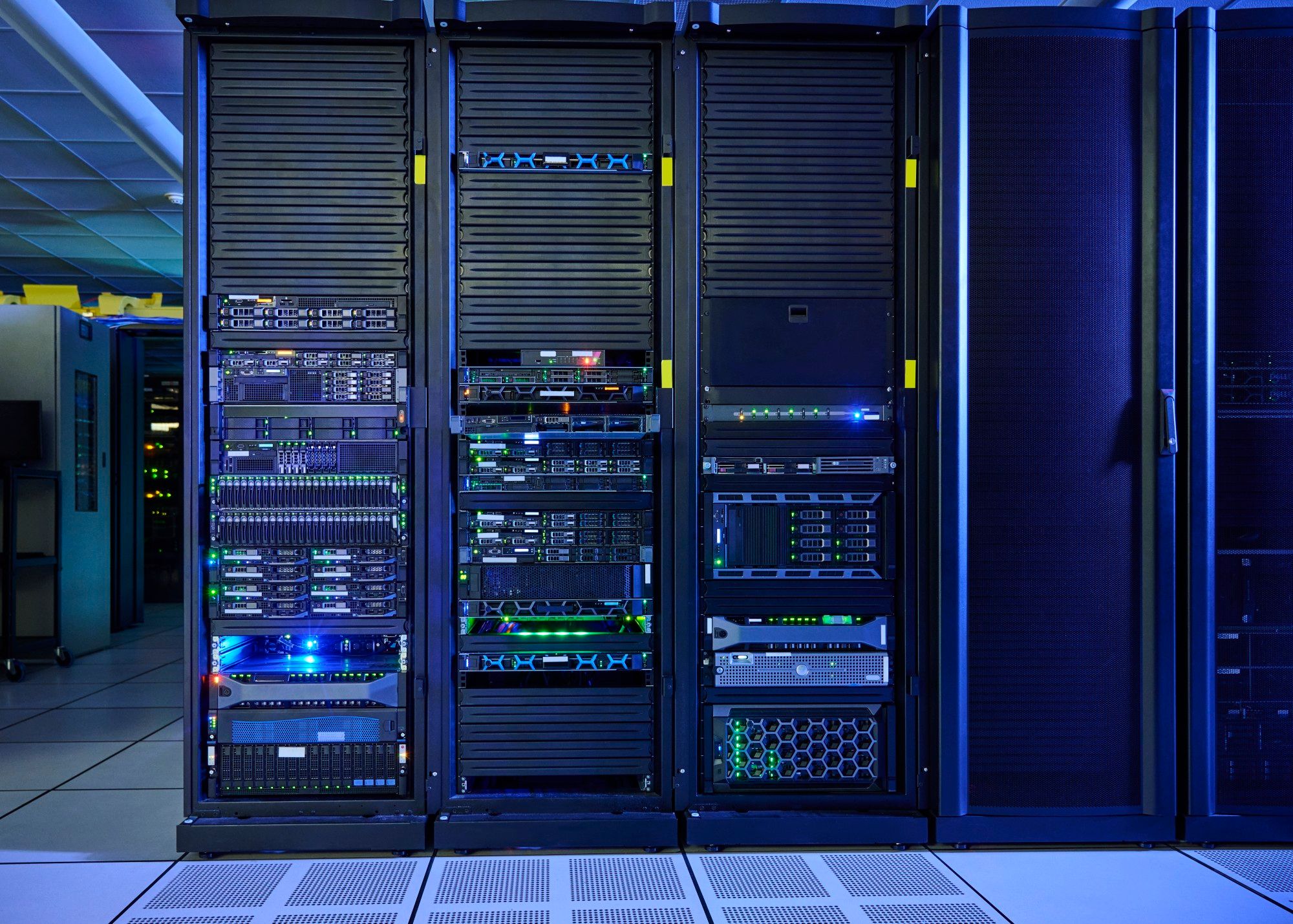 Server rack with rows of servers and blue status lights in an enterprise data center