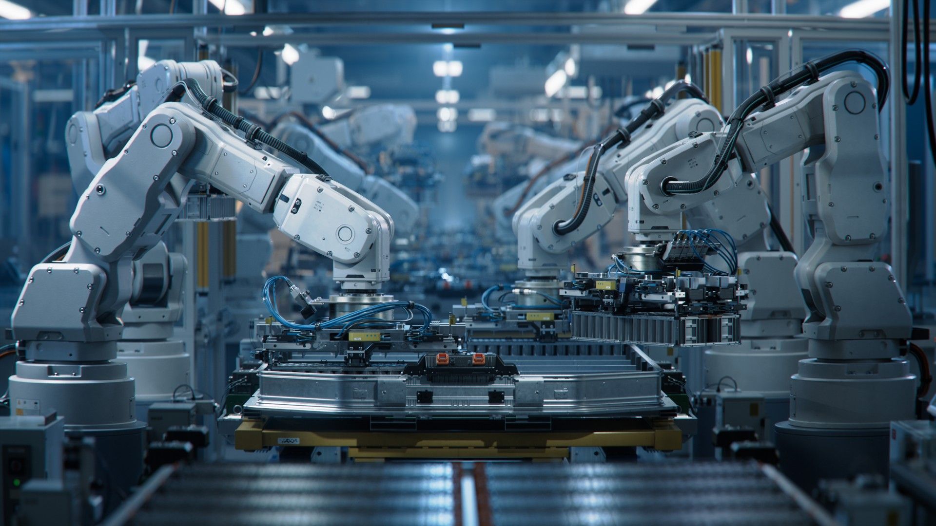 White robotic arms assembling an EV battery pack on an automated production line