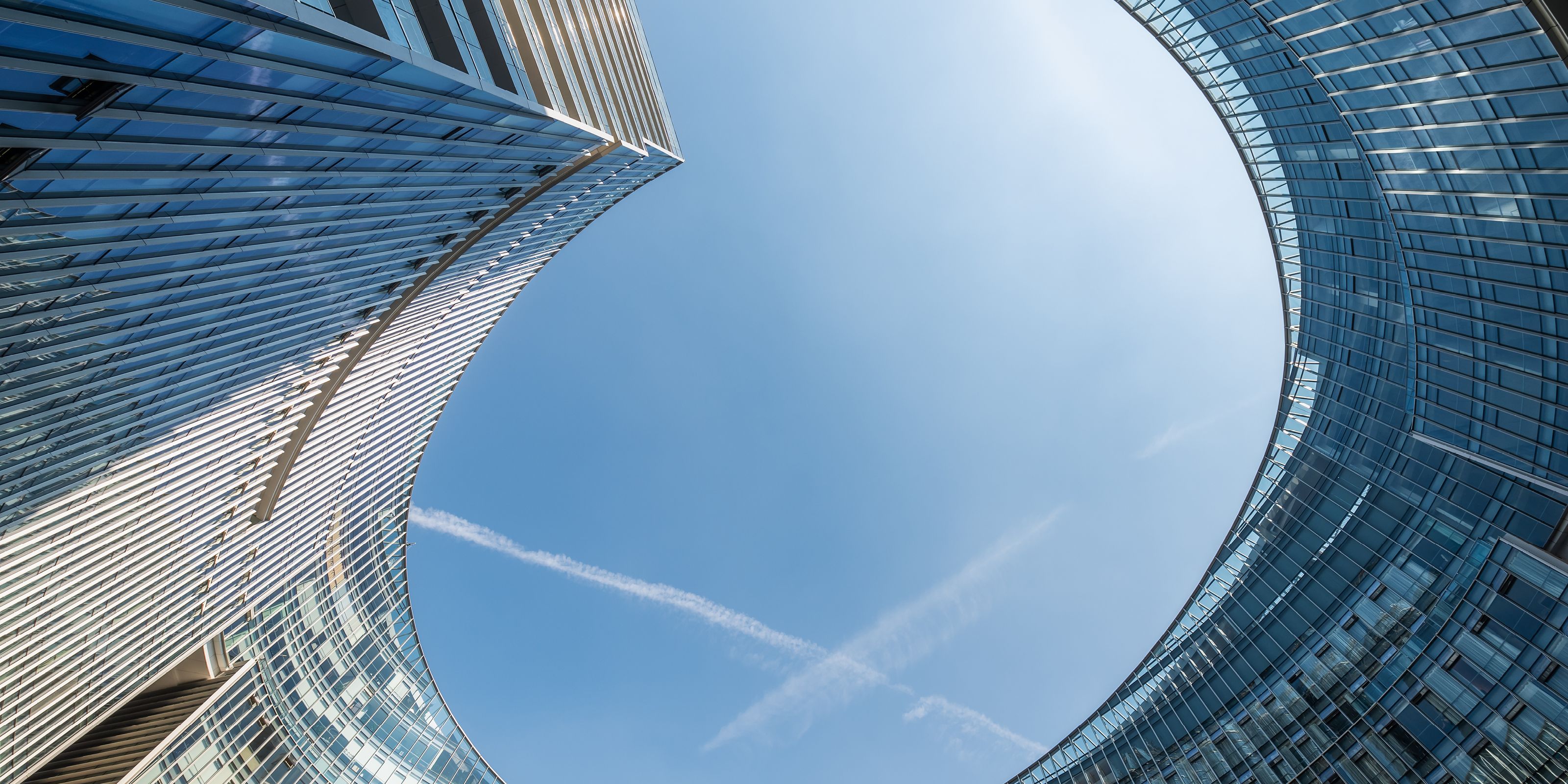 Aerial view of the sky from the vantage point between multiple buildings